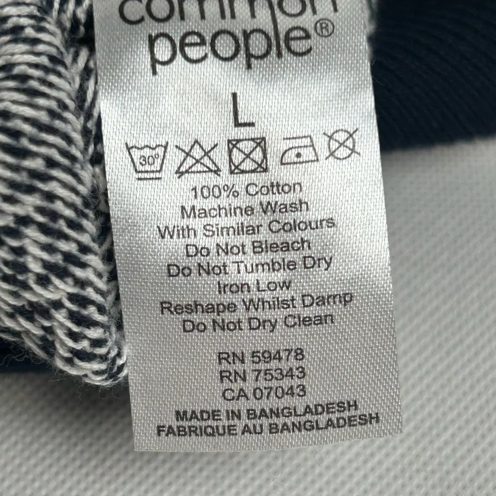 Blue and White Polo Shirt with Geometric Pattern - Picture 12 of 12